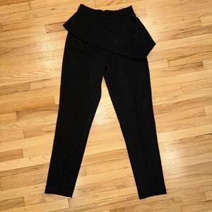 mistress rocks black pants with an  overskirt